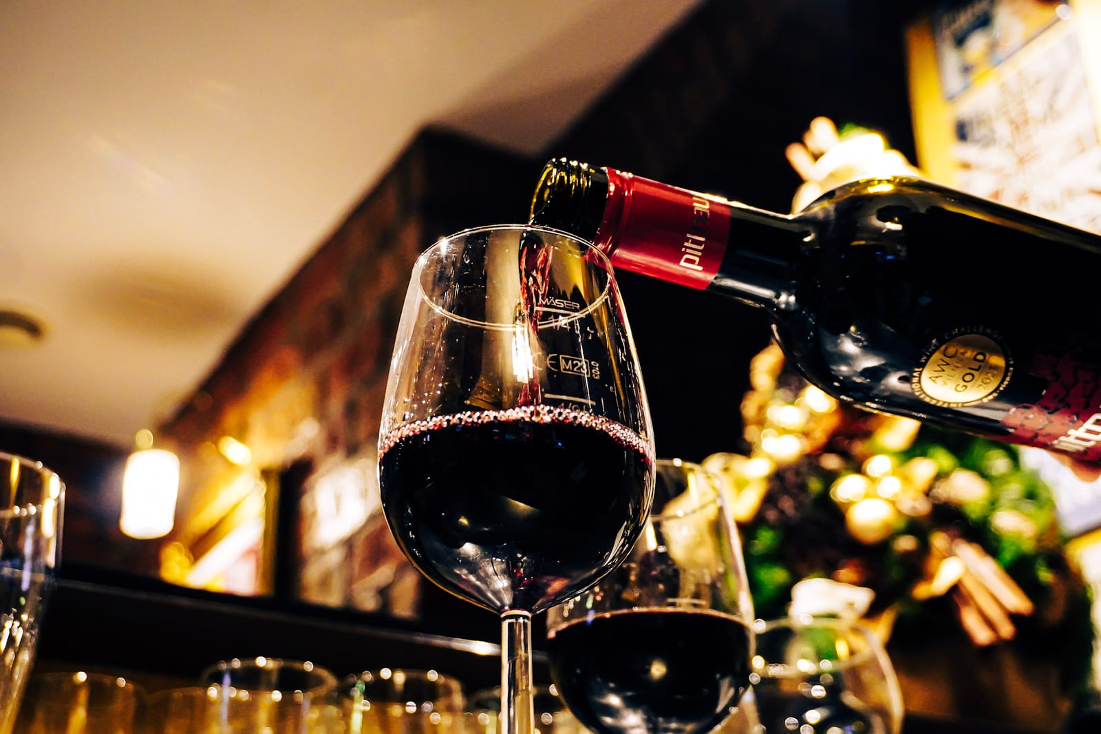 Red wine poured at the house bar